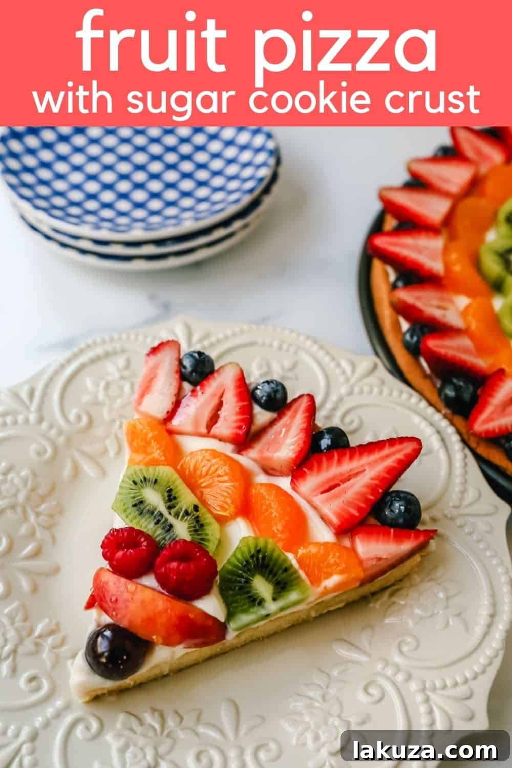 Sugar Cookie Fruit Tart 5 A vibrant, close-up shot of the finished fruit pizza, showcasing a beautiful arrangement of colorful fruits and the glistening jam glaze.
