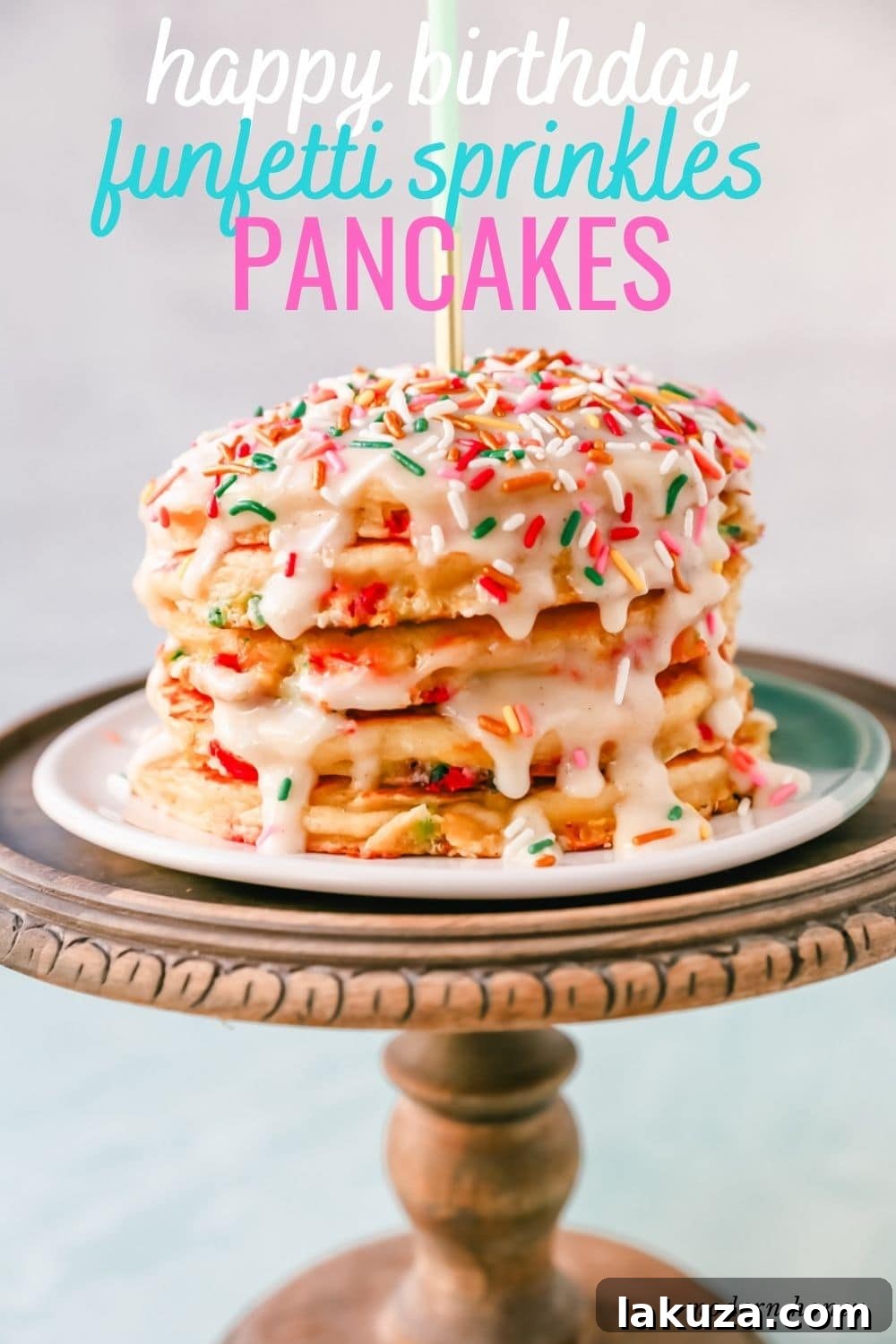 An overhead shot of a delightful stack of fluffy birthday pancakes, bursting with rainbow sprinkles and lavishly topped with a sweet cream cheese glaze, accompanied by a small glass of milk.
