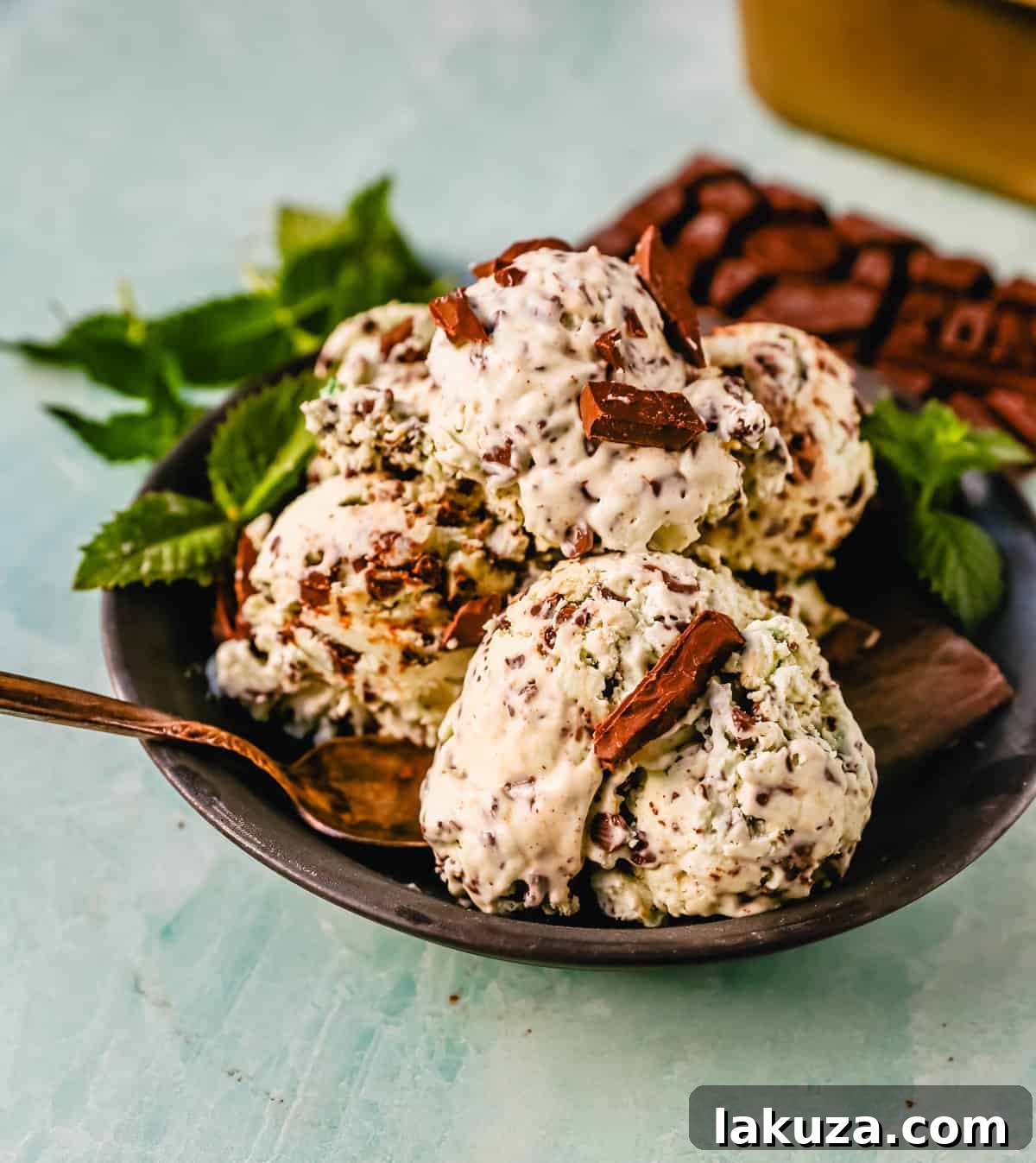 Emerald Mint Chocolate Dream 4 A beautifully textured scoop of homemade mint chocolate chip ice cream, highlighting the creamy base, vibrant mint, and generous chocolate chunks, perfect for hot weather.
