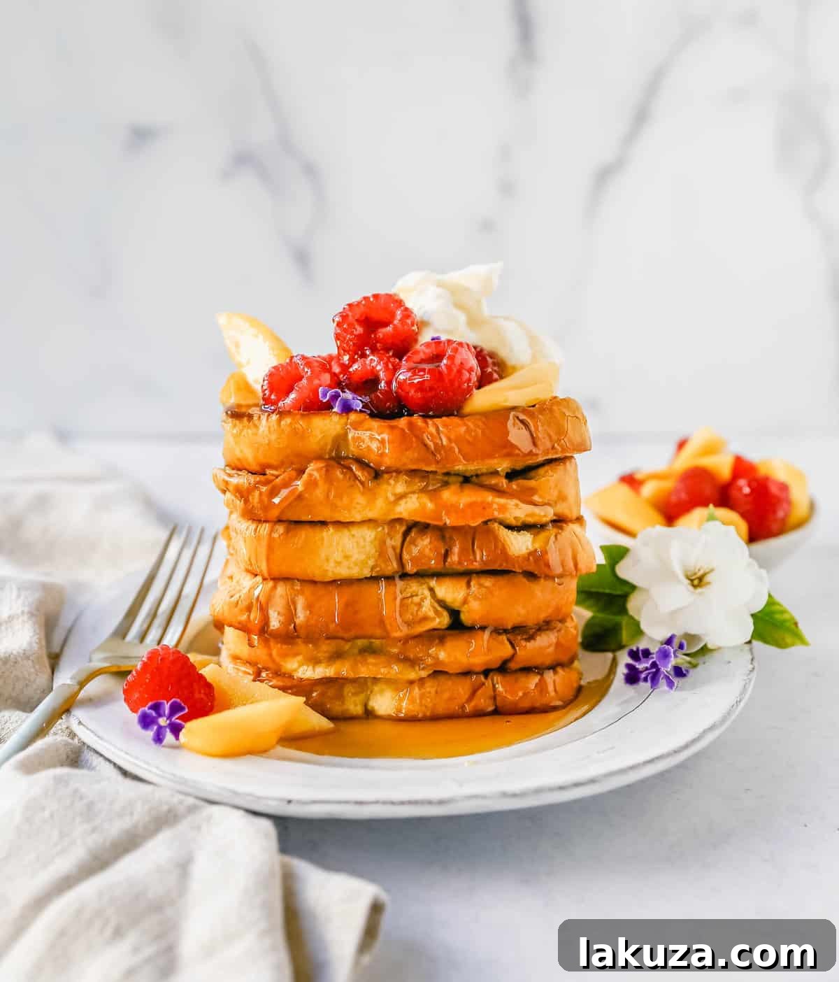 One-Pan French Toast Bake 4 Sheet Pan French Toast drizzled with syrup and topped with fresh berries and mascarpone cream.