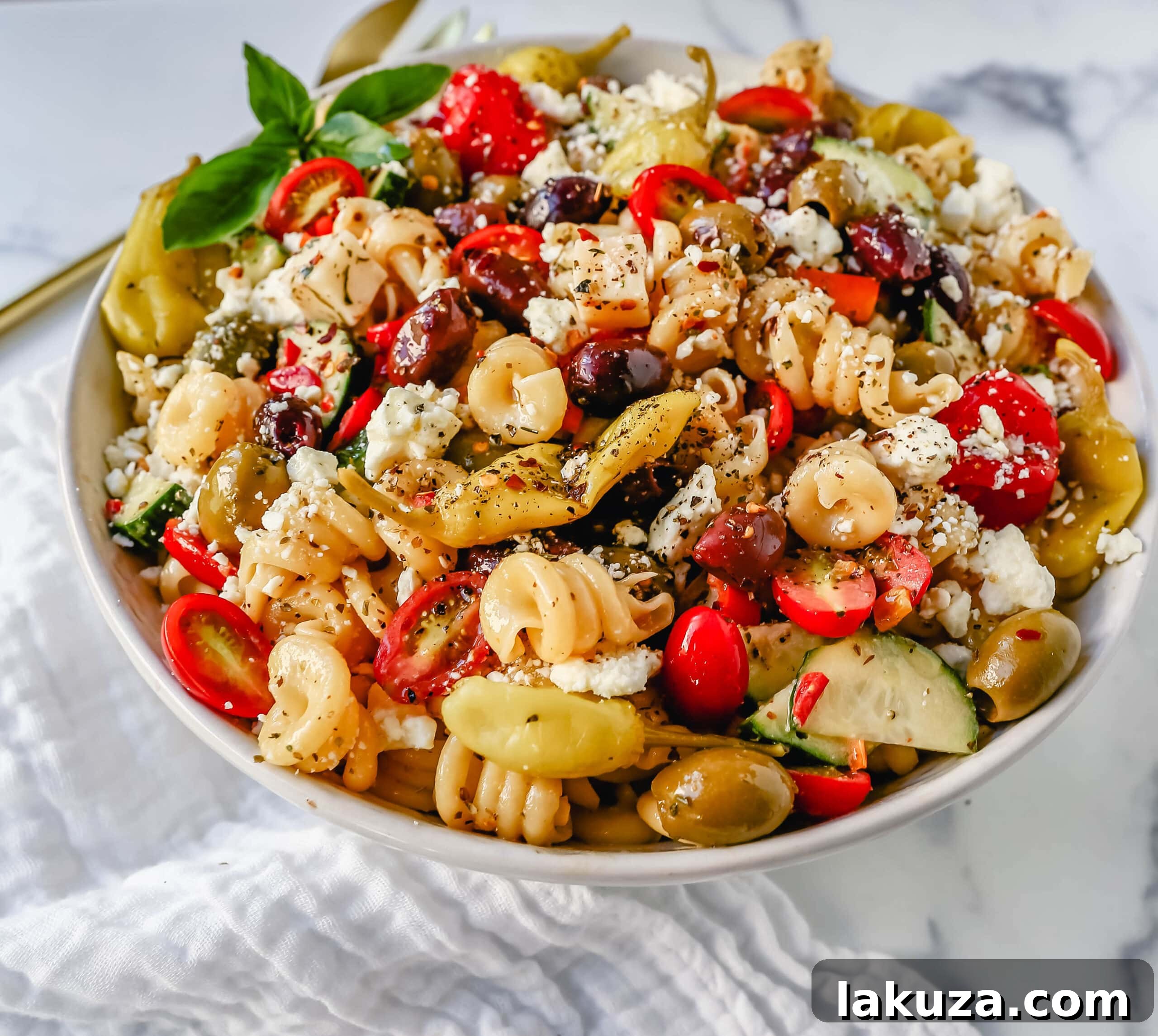 Close-up of Homemade Greek Pasta Salad showcasing a rich array of colorful ingredients.