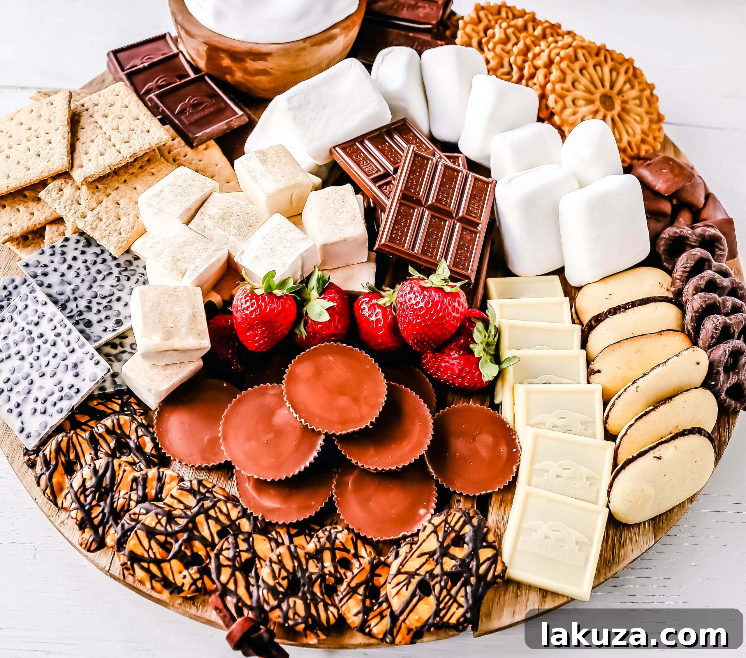 How to make the Ultimate S'mores. How to create a fun S'mores Board with all of the toppings. Perfect for campfires in the mountains, at the beach, or in your backyard! S'mores are the perfect customizable summer treat.