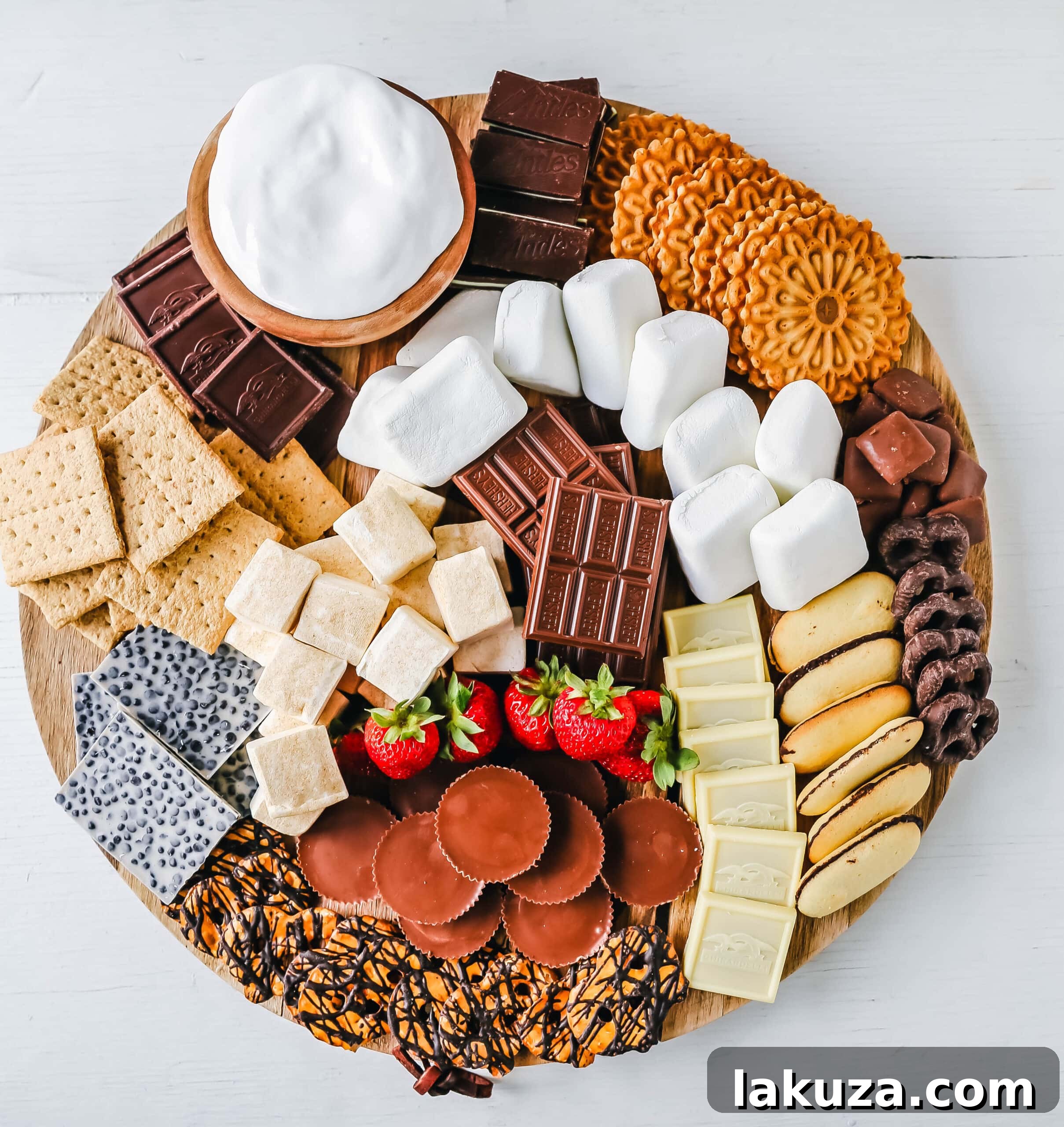 How to make the Ultimate S'mores. How to create a fun S'mores Board with all of the toppings. Perfect for campfires in the mountains, at the beach, or in your backyard! S'mores are the perfect customizable summer treat.