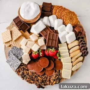 How to make the Ultimate S'mores. How to create a fun S'mores Board with all of the toppings. Perfect for campfires in the mountains, at the beach, or in your backyard! S'mores are the perfect customizable summer treat.