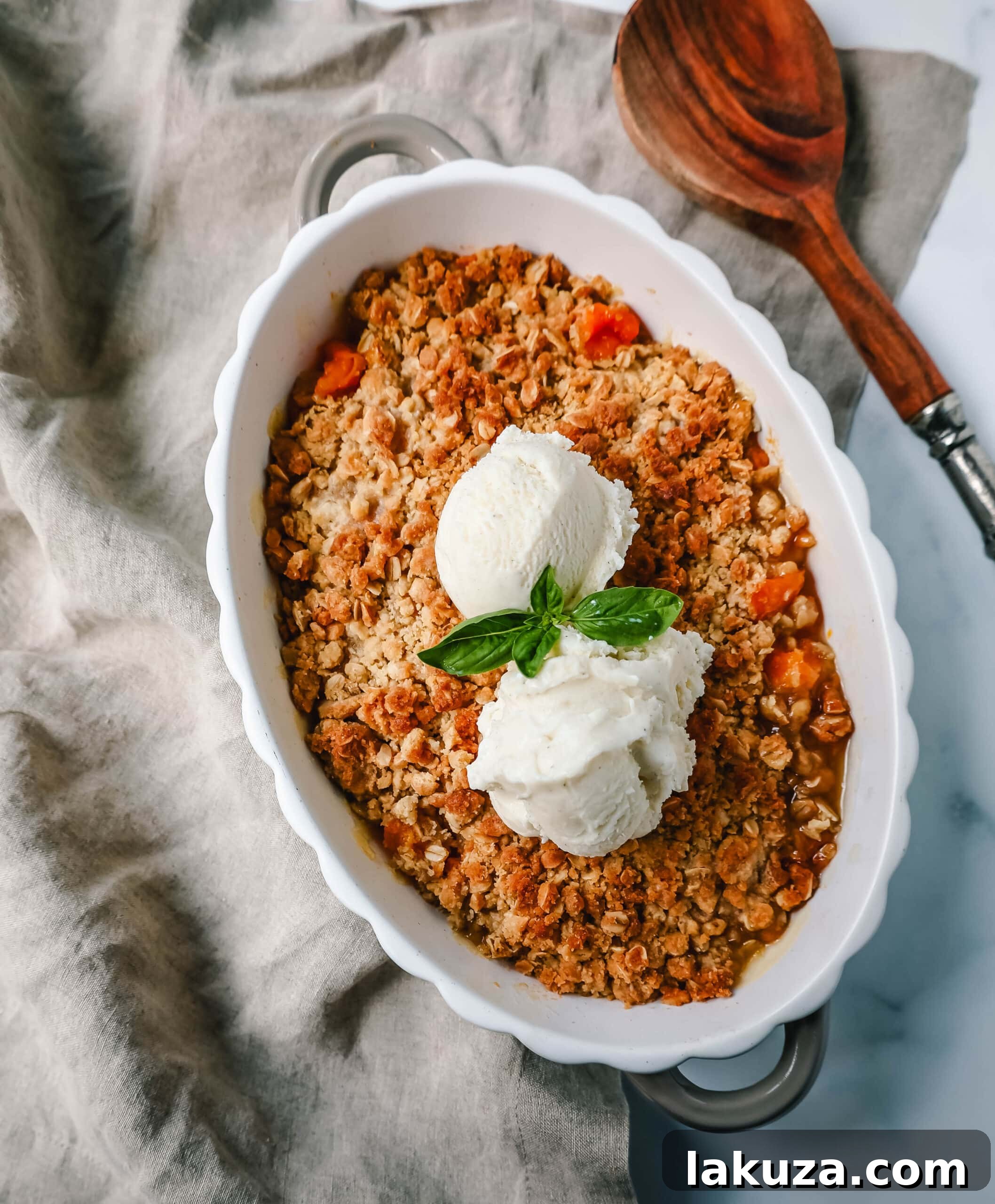 Sun-Kissed Apricot Crumble 4 Perfectly pitted and chopped fresh apricots tossed with sugar and almond extract, glistening in a mixing bowl, ready for the oven.