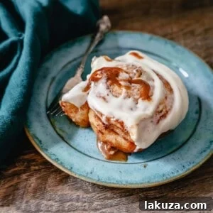The famous, viral TikTok Cinnamon Rolls with heavy cream are even better than Cinnabon! These TikTok Cinnamon Rolls made with canned cinnamon rolls, a homemade buttery cinnamon drizzle, and a cream cheese frosting are the easiest cinnamon rolls you will ever make! 