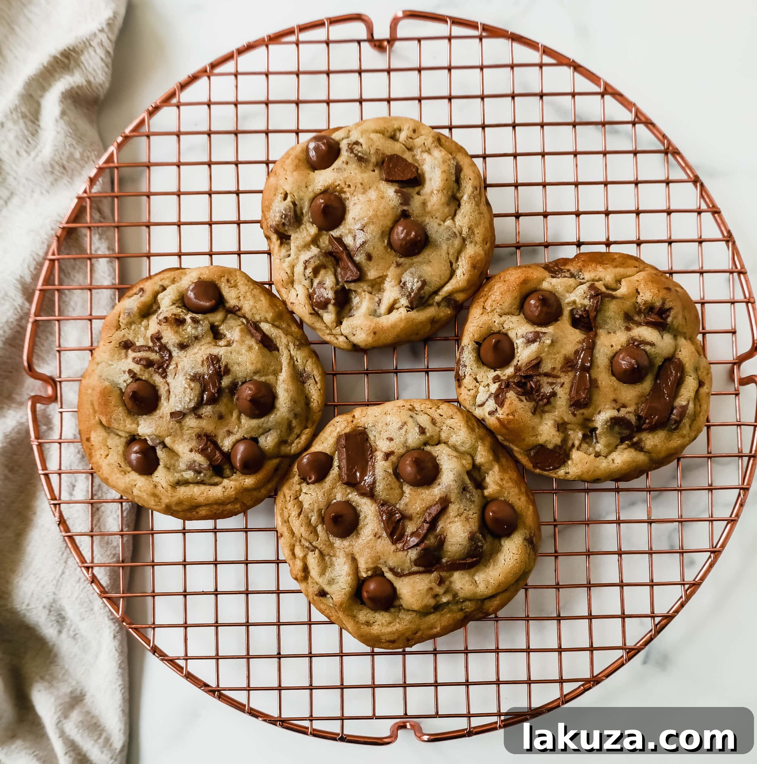 Irresistible Milk Chocolate Chip Delights 4 A freshly baked milk chocolate chip cookie, still warm on a cooling rack, with sea salt flakes sprinkled on top. The best homemade milk chocolate cookies.