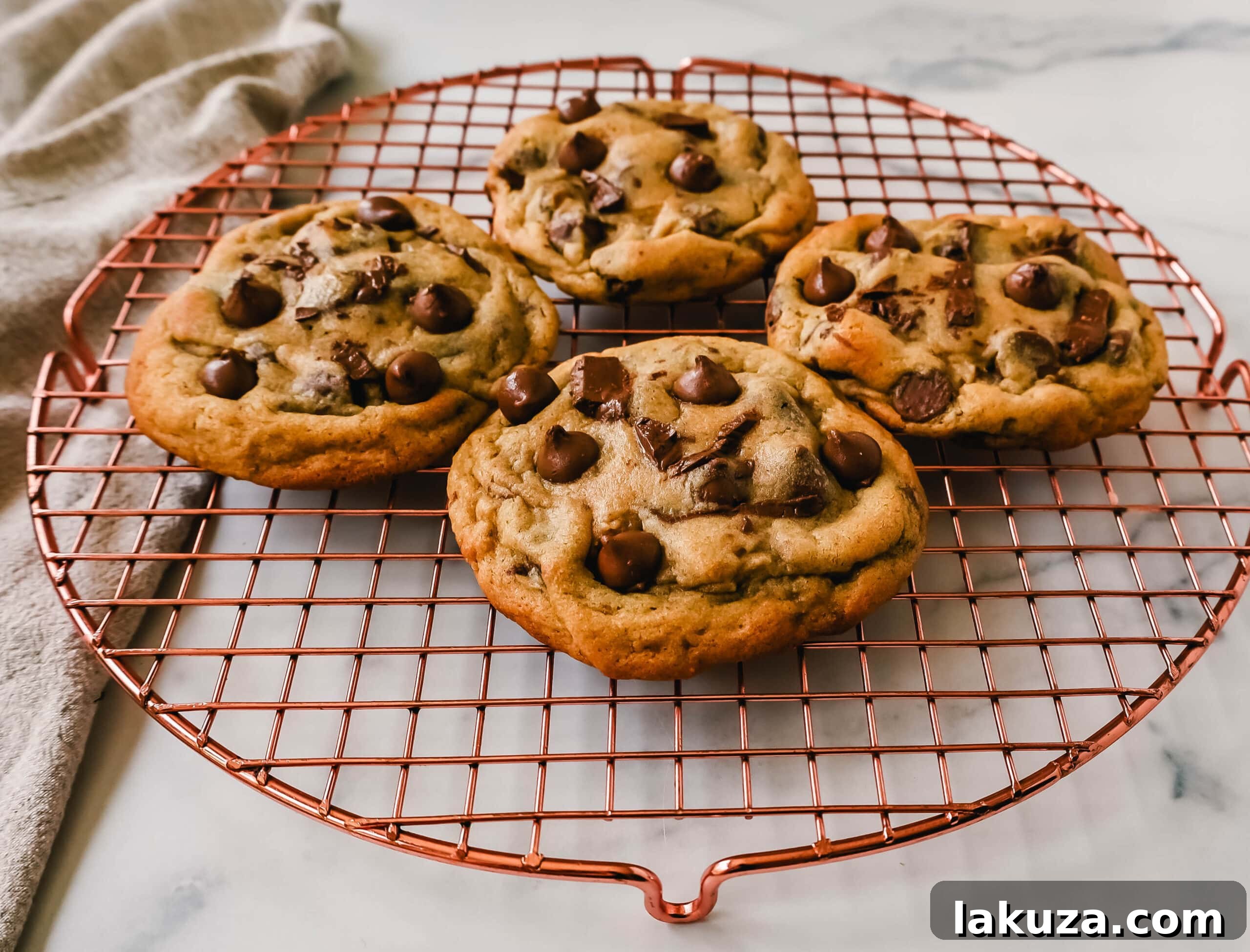 Irresistible Milk Chocolate Chip Delights 6 Ingredients for milk chocolate chip cookies laid out on a baking surface, ready for preparation. Homemade cookie ingredients.