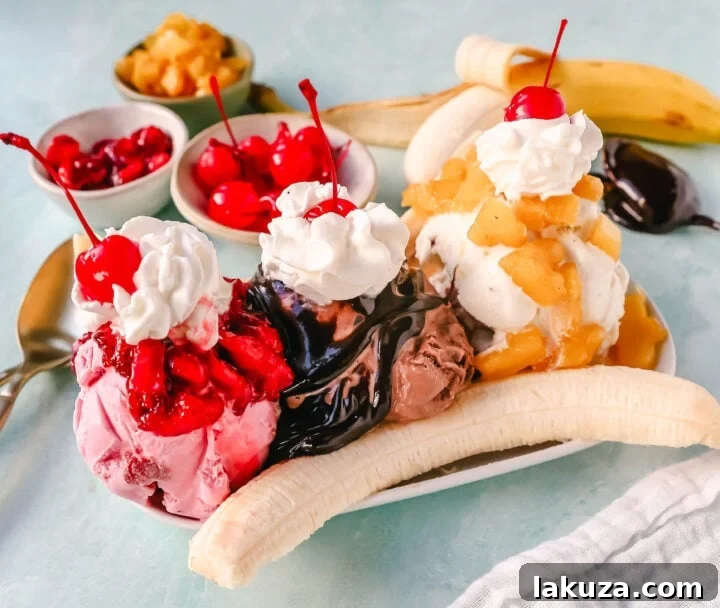 A classic Banana Split recipe made with fresh bananas, chocolate ice cream with hot fudge sauce, strawberry ice cream with strawberry sauce, vanilla ice cream with pineapple sauce, whipped cream, and cherry.