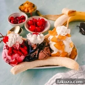 A classic Banana Split recipe made with fresh bananas, chocolate ice cream with hot fudge sauce, strawberry ice cream with strawberry sauce, vanilla ice cream with pineapple sauce, whipped cream, and cherry.
