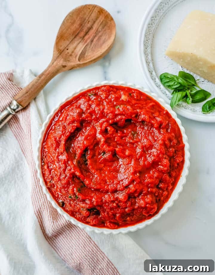 Rich homemade San Marzano Marinara Sauce simmering in a pot