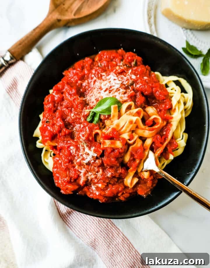 Close-up of homemade Marinara Sauce with fresh pasta, ready to serve