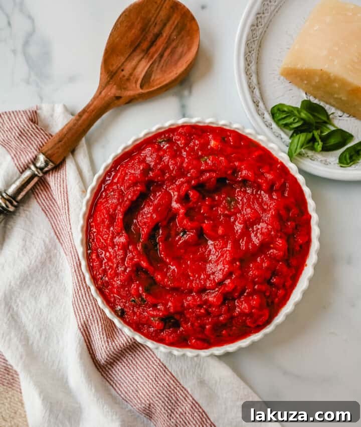 A bowl of delicious San Marzano marinara sauce, garnished with fresh basil