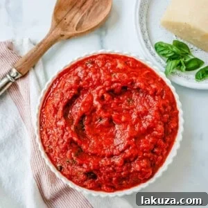 A bowl of delicious San Marzano marinara sauce, garnished with fresh basil
