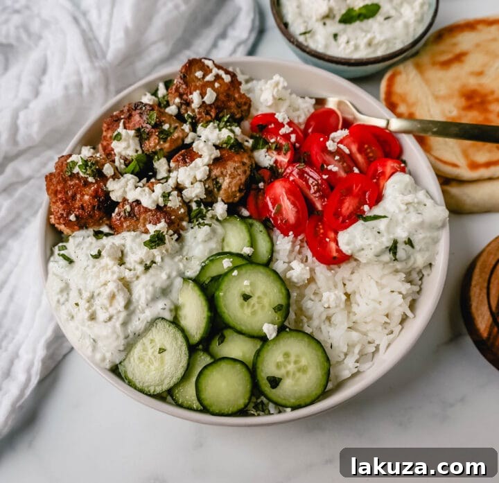 Raw Greek Chicken Meatball ingredients mixed in a bowl, ready for cooking.