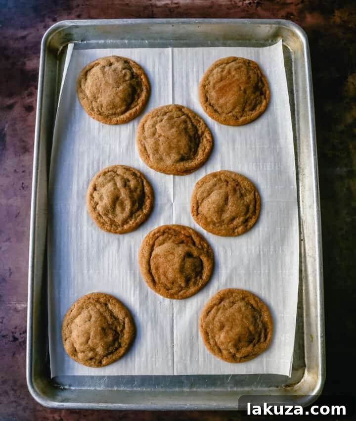 A stack of golden Brown Sugar Cookies with a perfect, slightly crinkled top texture.