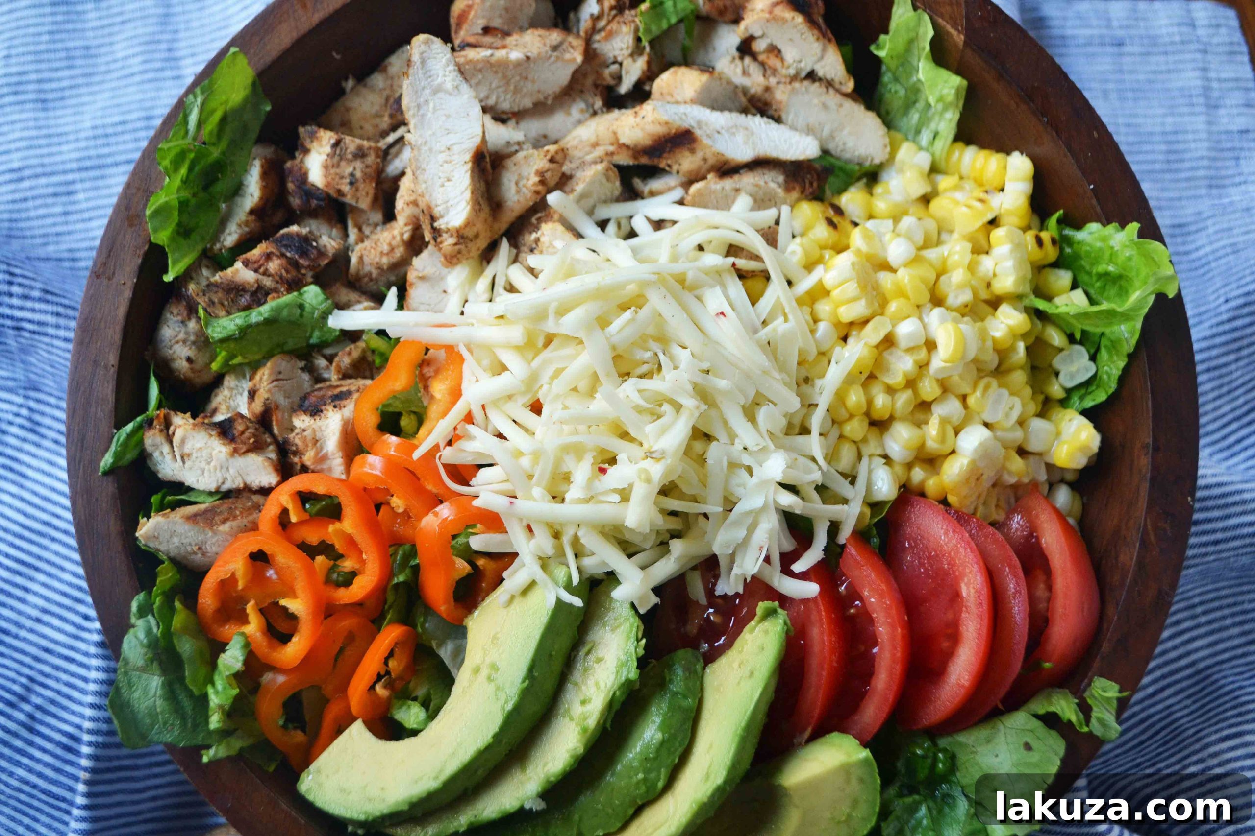Fiesta Chicken Chopped Salad with Cilantro Lime Ranch 4 Ingredients for Southwestern Chicken Chopped Salad being prepared, including fresh corn and avocado