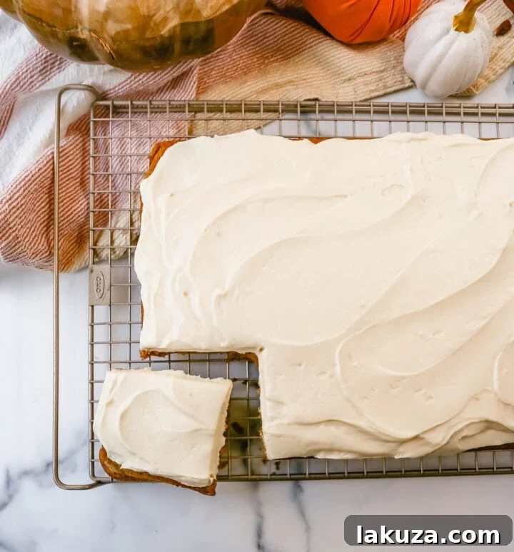 Spiced Pumpkin Bars with Tangy Cream Cheese Frosting 2 Moist Pumpkin Bars with Cream Cheese Frosting for a delightful fall dessert