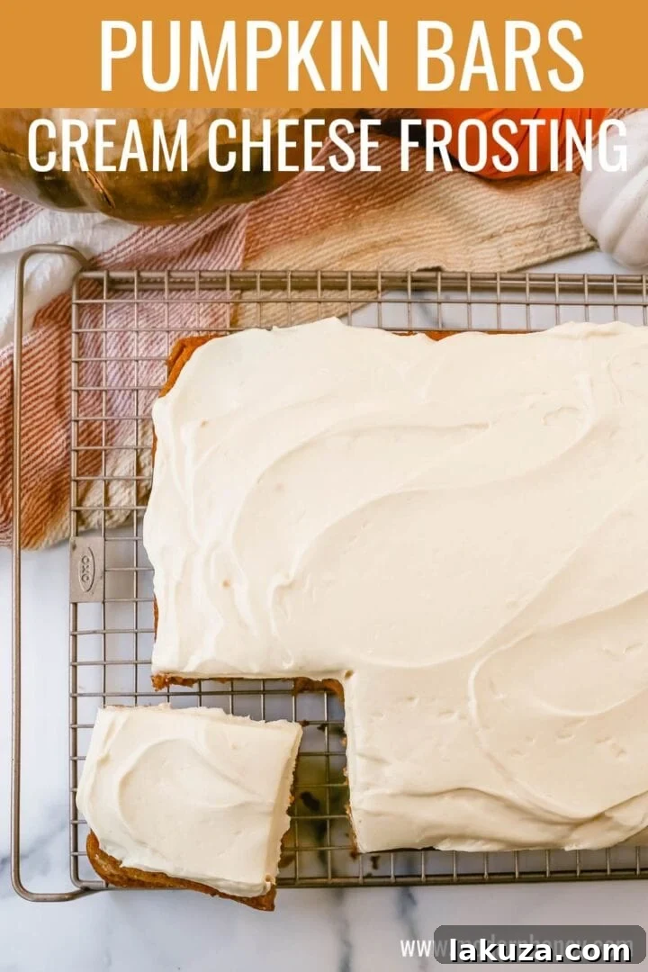 Spiced Pumpkin Bars with Tangy Cream Cheese Frosting 9 Large batch of Pumpkin Bars with Cream Cheese Frosting, cut into squares
