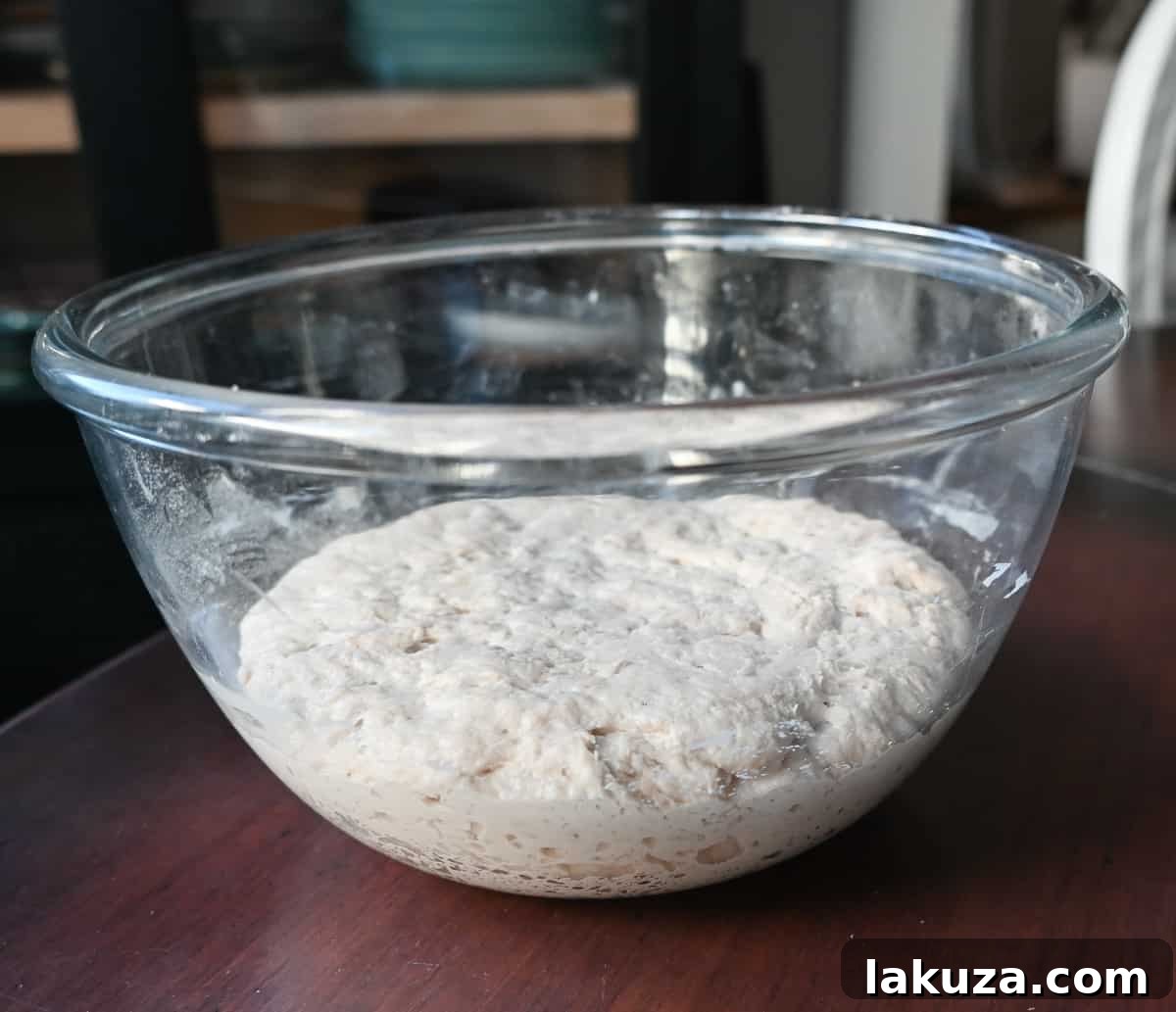Effortless Overnight Artisan Loaf 13 A Dutch oven heating inside a hot oven, preparing it for baking the no-knead bread.