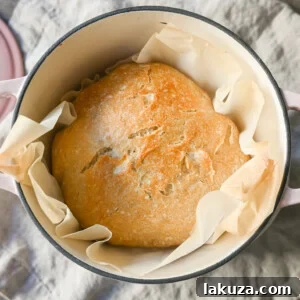 No-Knead Overnight Crusty Bread Recipe. This No-Knead Bread is baked in a Dutch oven and is the perfect crusty French bread recipe. This makes a beautiful artisan loaf of bread and is so easy! The only ingredients you need are flour, water, salt, and yeast for the perfect overnight crusty bread.