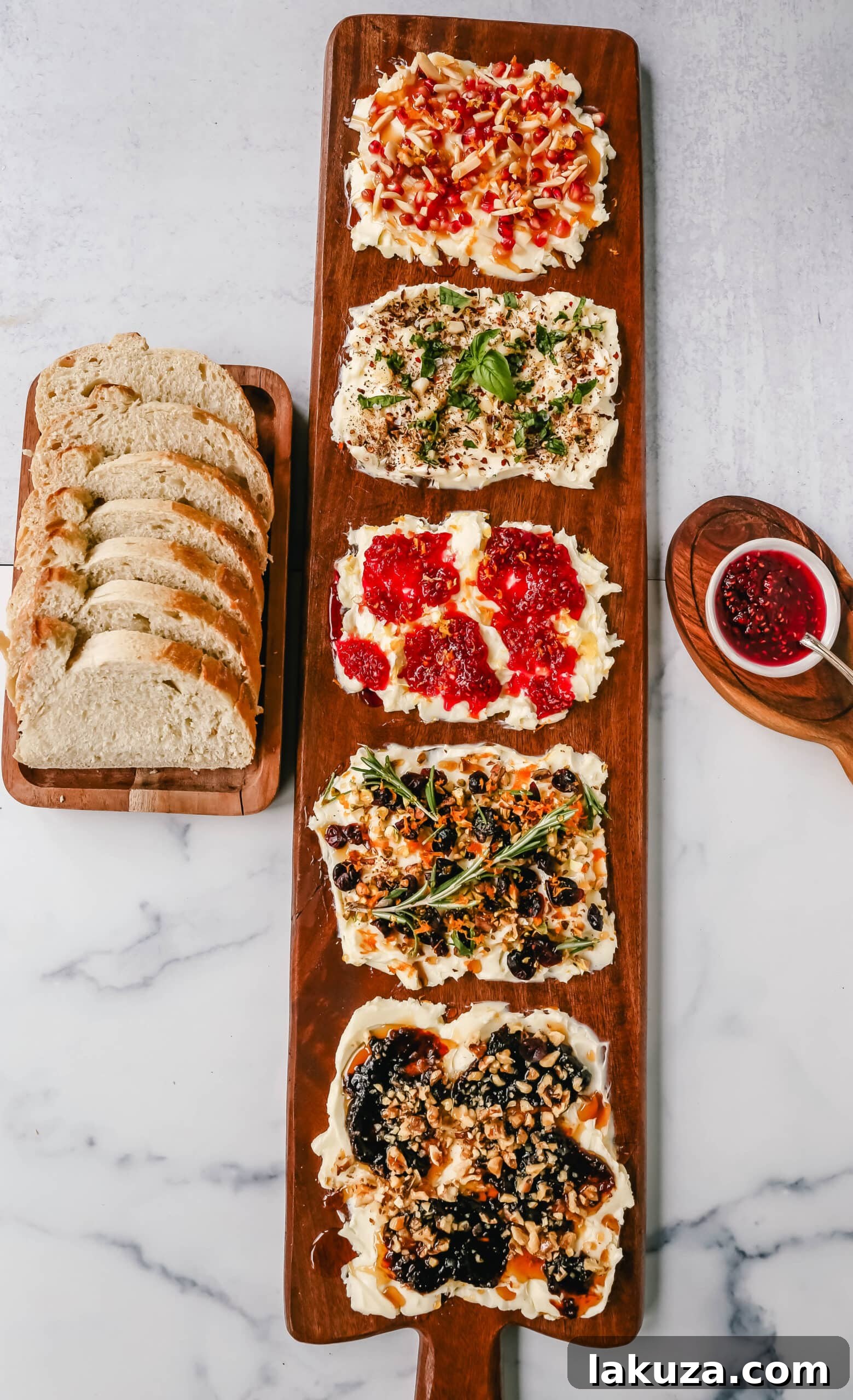 Creamy Culinary Canvas 2 A beautifully arranged Butter Board featuring softened butter, sweet fig jam, crunchy walnuts, a drizzle of hot honey, and slices of warm French bread, perfect for dipping at a party.