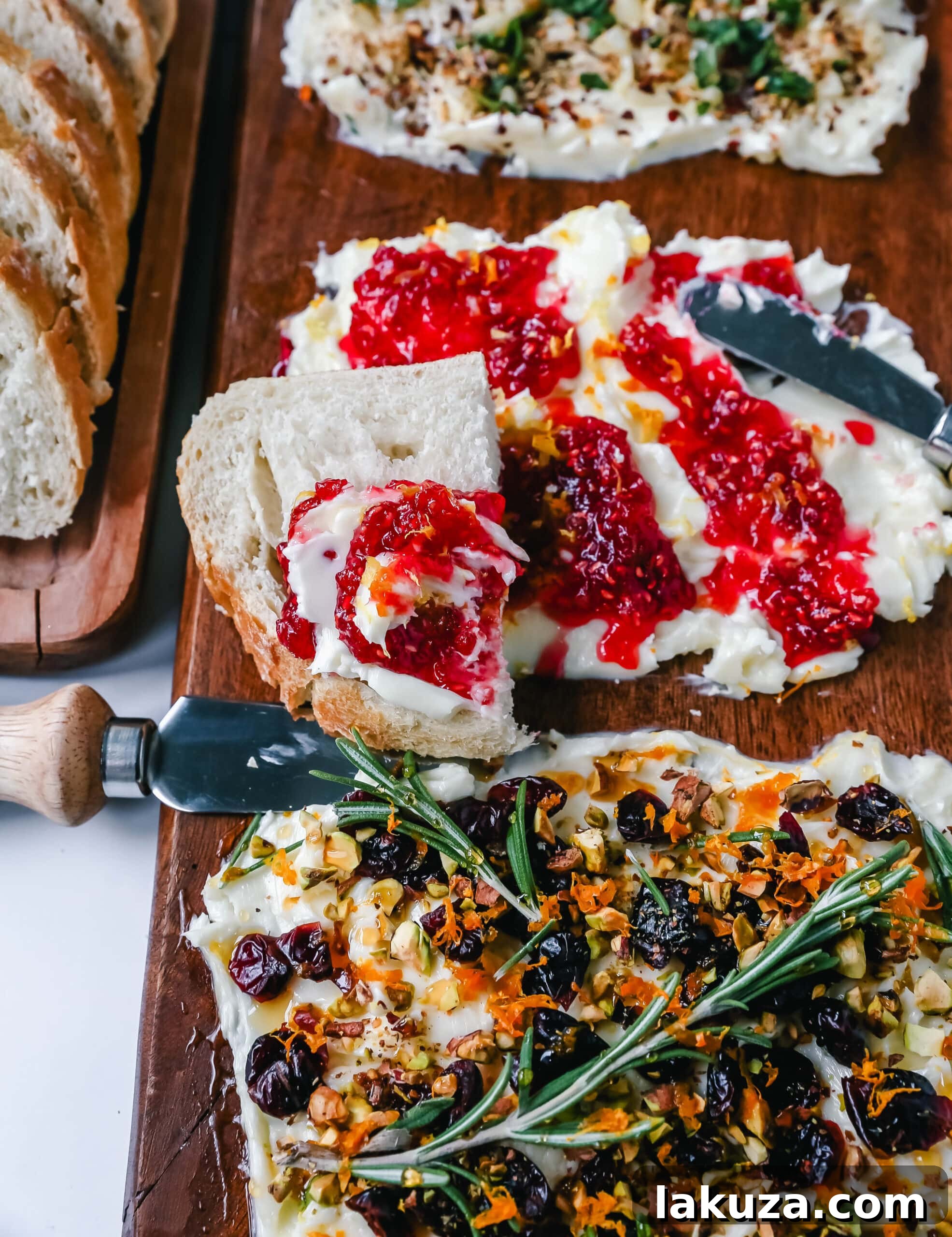 Creamy Culinary Canvas 3 Close-up of a Butter Board showcasing a vibrant sweet section with berry jam, lemon zest, and honey, alongside a savory roasted garlic and herb butter, served with crisp bread slices.