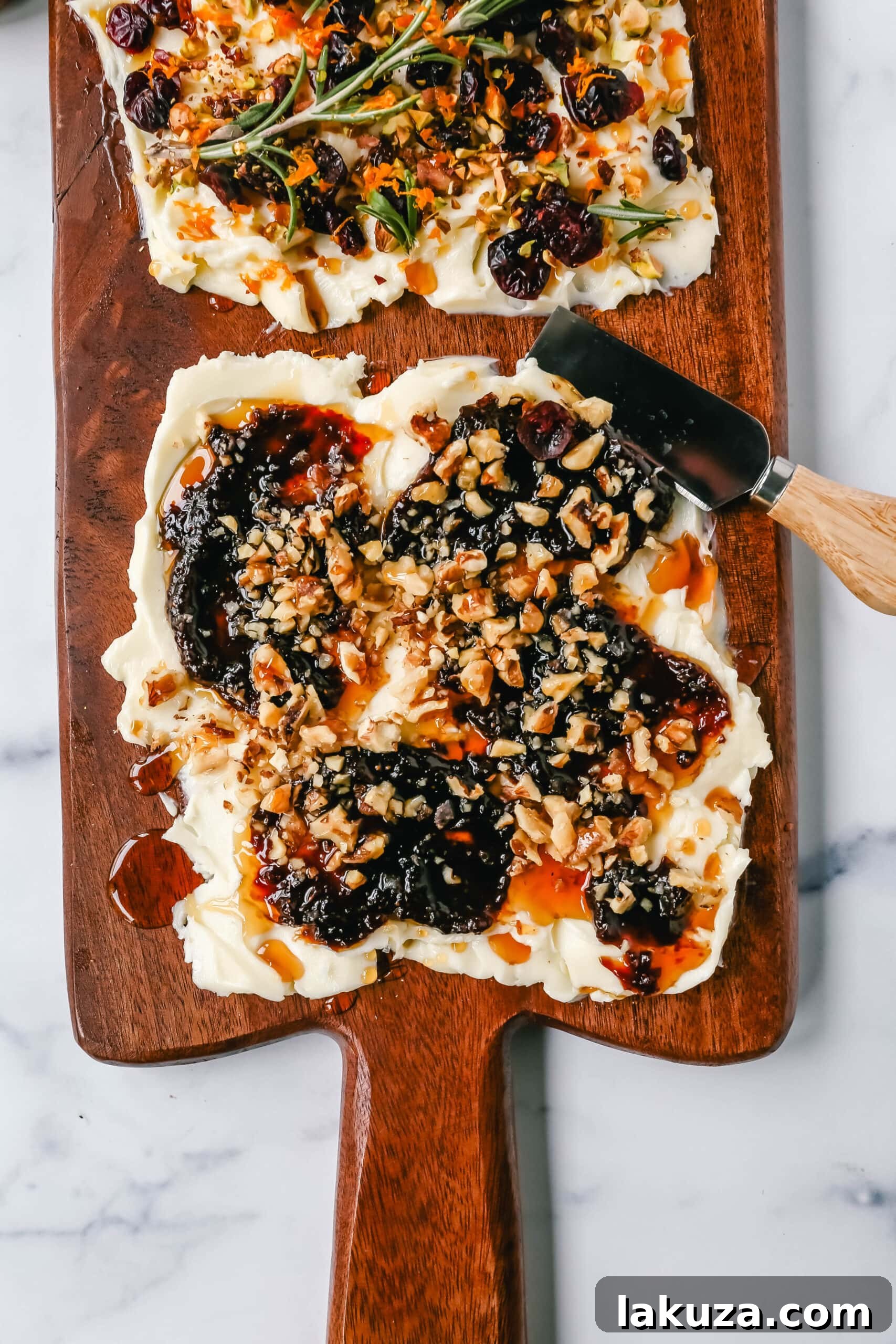 Creamy Culinary Canvas 4 Overhead view of a diverse Butter Board featuring sweet sections with fruit and honey, and savory sections with herbs and spices, prepared for a festive occasion.