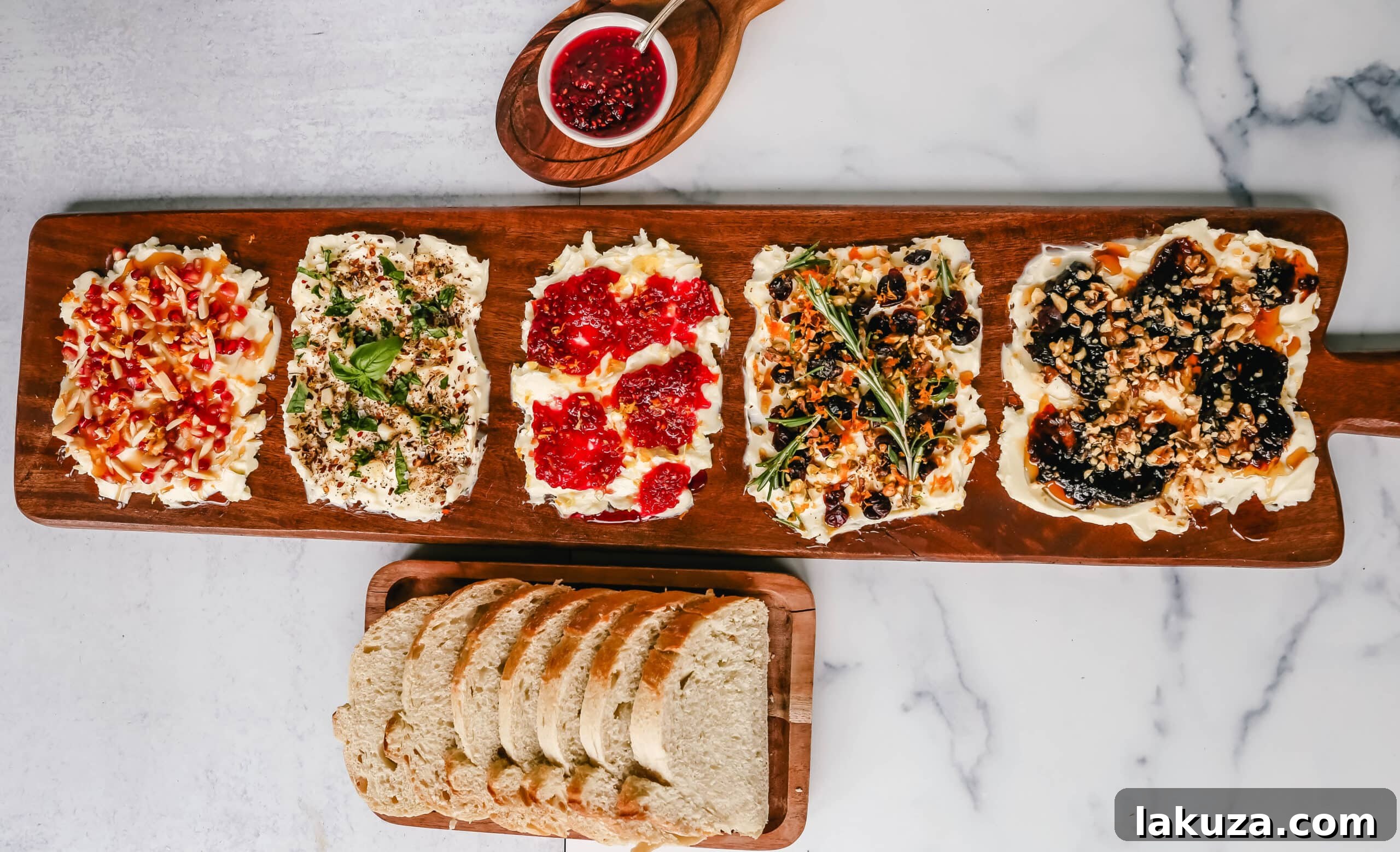 Creamy Culinary Canvas 5 A section of a Butter Board focused on a savory combination of butter, roasted garlic, fresh basil, and red chili flakes, ready to be enjoyed with bread.