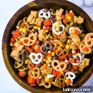 Monster Munch Mix 7 Ultimate Halloween Sweet and Salty Snack Mix, a perfect balance of flavors for Fall festivities.