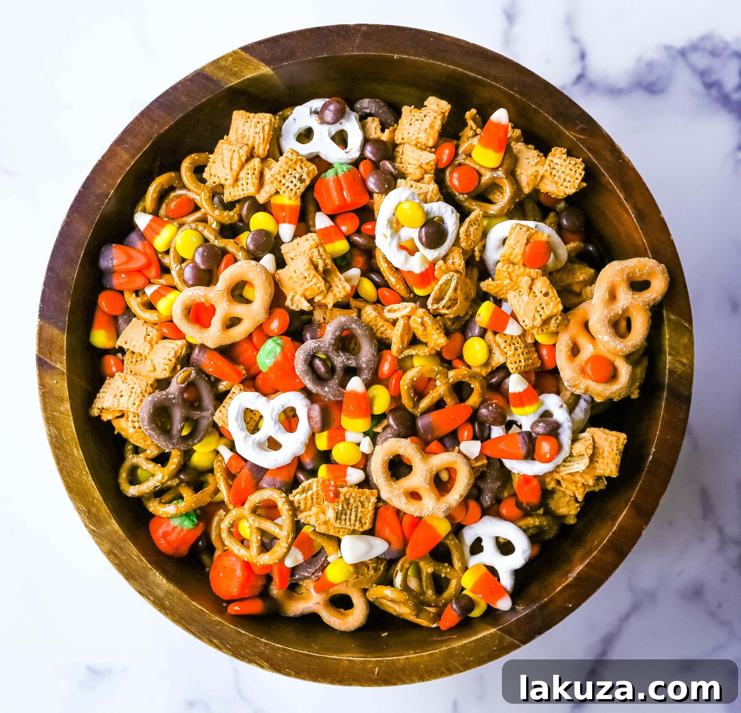 Monster Munch Mix 4 Variety of Halloween Sweet and Salty Snack Mix ingredients in bowls, ready to be combined.