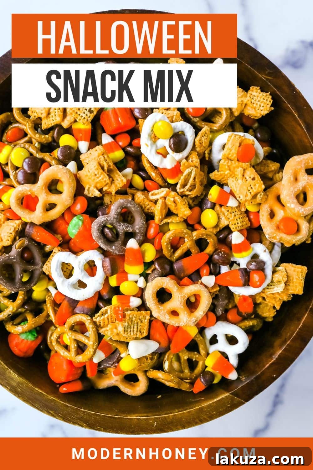 Monster Munch Mix 6 A close-up of a bowl filled with the Halloween Sweet and Salty Snack Mix, showcasing its tempting variety of textures and colors.