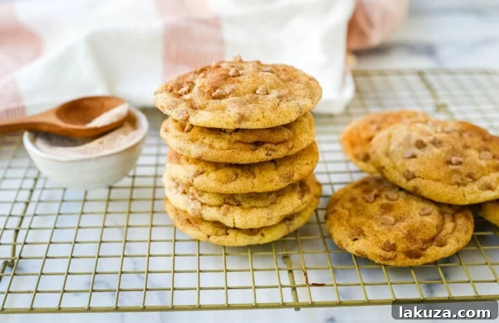 Spiced Cinnamon Chip Cookies 2 A plate of perfectly baked, soft, and chewy Cinnamon Chip Sugar Cookies, generously coated in cinnamon sugar and brimming with melted cinnamon chips.