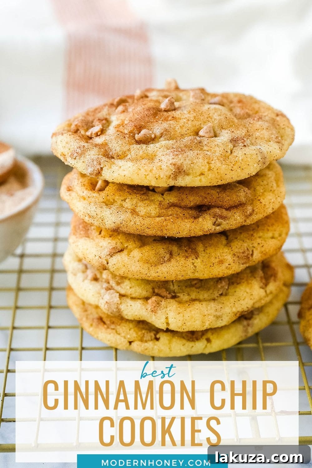 Spiced Cinnamon Chip Cookies 7 A high-angle shot of numerous Cinnamon Chip Sugar Cookies, golden and perfectly round, arranged beautifully on a rustic wooden surface.