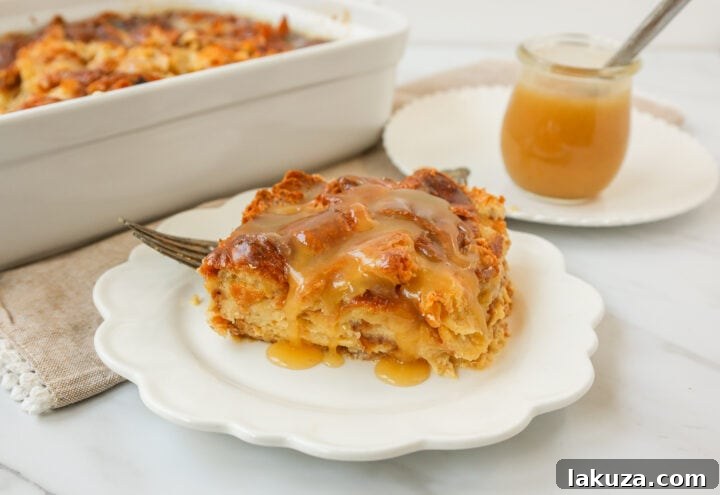 Heavenly Croissant Bake 4 A close-up of the golden-brown Croissant Bread Pudding, perfectly baked and ready for a generous drizzle of vanilla sauce.