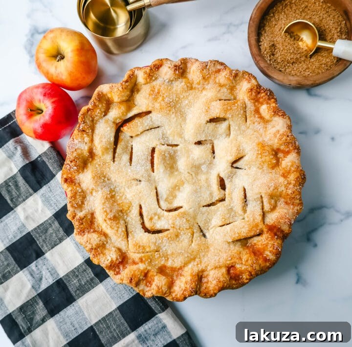 The Best Homemade Apple Pie Recipe! A golden brown, flaky crust apple pie sliced, revealing sweet apple filling.