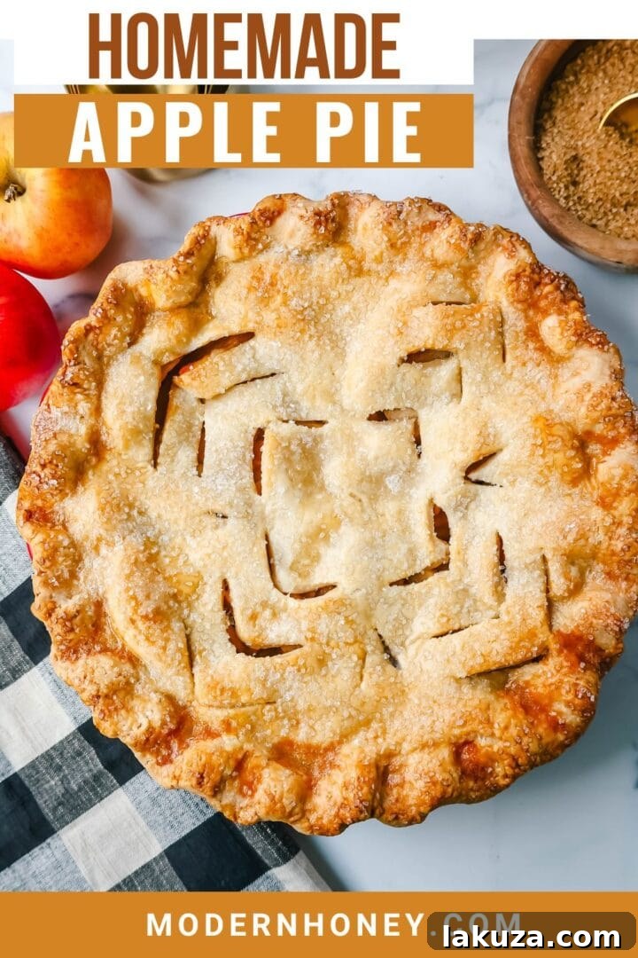 A freshly baked, golden homemade apple pie, still warm and inviting.