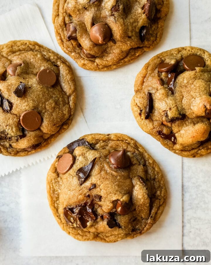 Irresistible Chocolate Chip Cookies 5 Freshly baked chocolate chip cookies cooling on a wire rack.