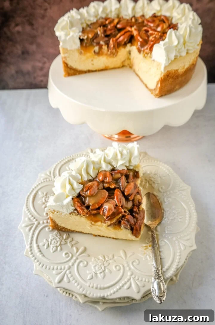 Slice of Southern Pecan Praline Cheesecake showing its creamy layers and generous praline topping, ideal for Thanksgiving dessert.