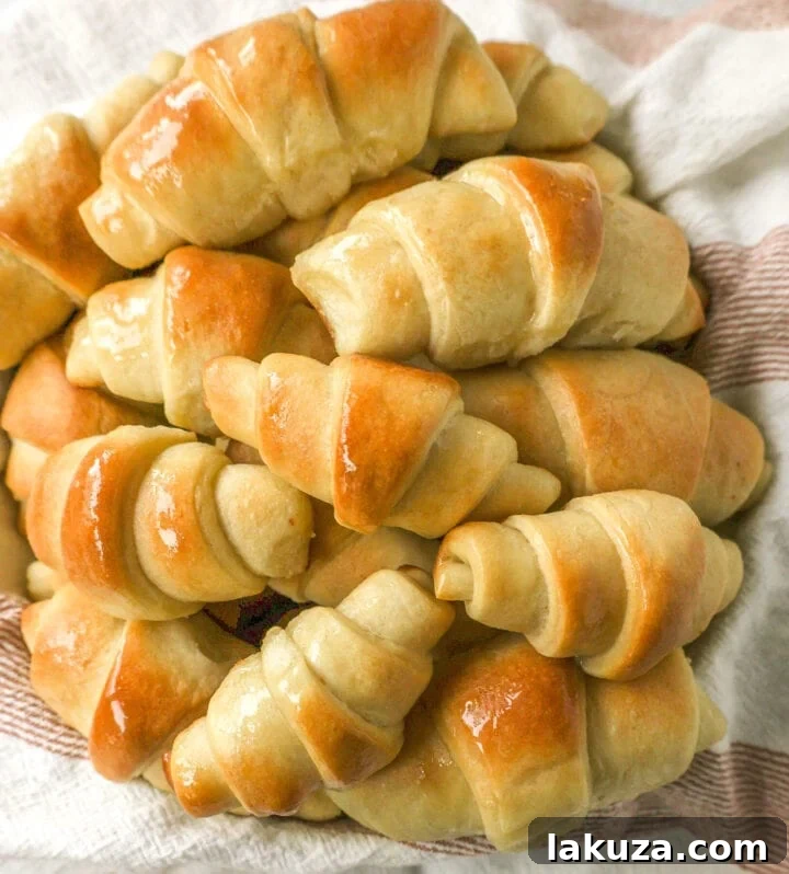Golden Flaky Crescents 11 Freshly baked crescent rolls with a generous brush of melted butter.