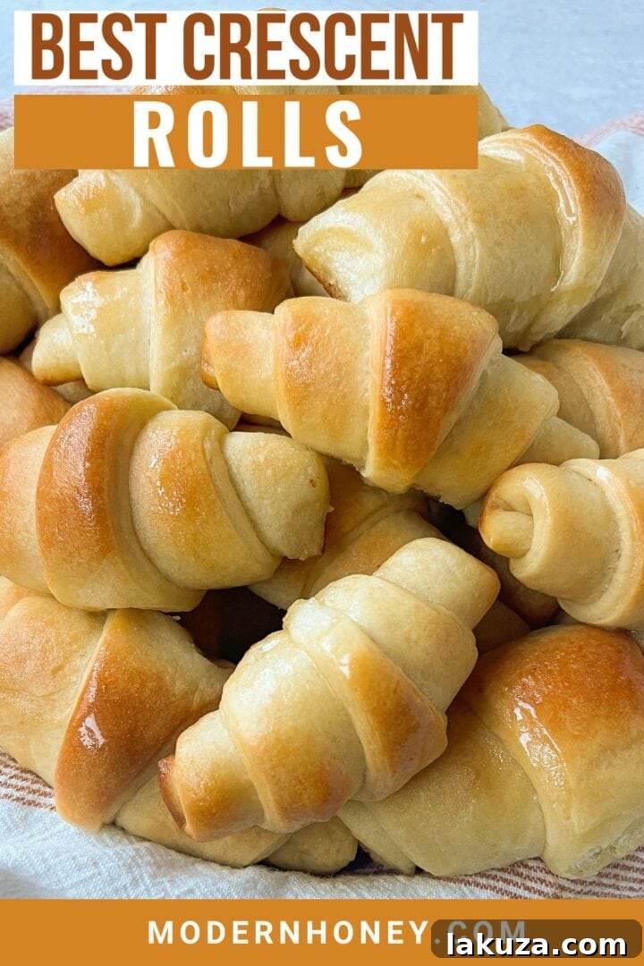 Golden Flaky Crescents 13 Beautifully arranged homemade crescent rolls, golden brown and glistening with melted butter.