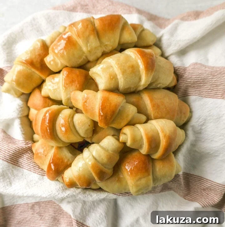 Golden Flaky Crescents 4 Close-up of fresh ingredients for homemade crescent rolls, including flour, butter, and yeast.