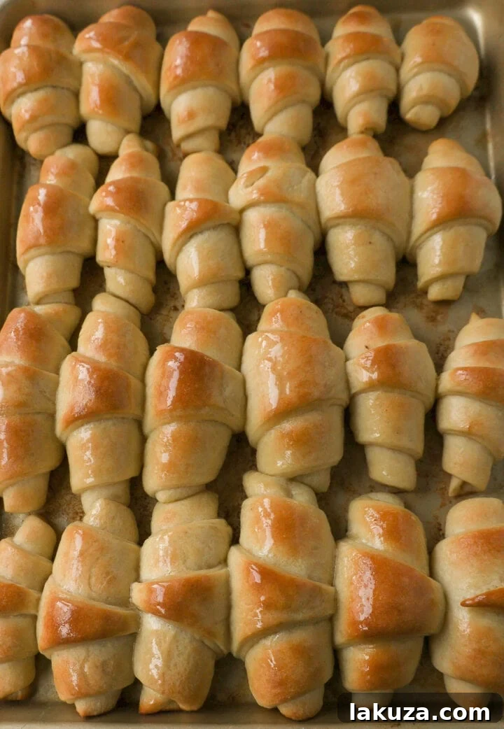 Golden Flaky Crescents 5 Activated foamy yeast mixture in a bowl, a sign of successful yeast proofing for baking.