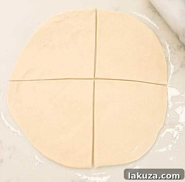 Golden Flaky Crescents 7 Homemade Crescent Rolls Dough cut into quarters. A visual guide on how to roll out crescent rolls.