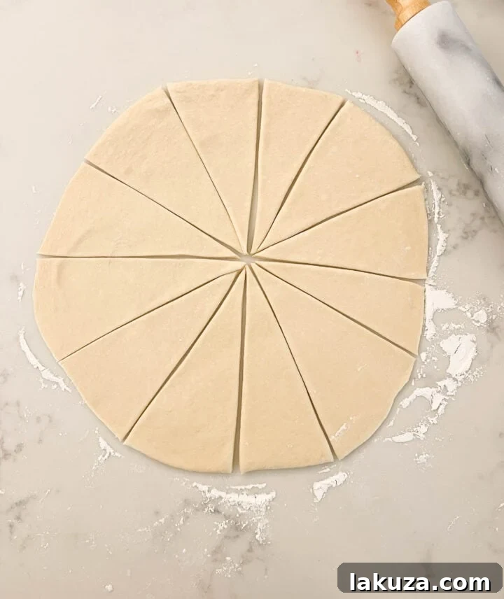 Golden Flaky Crescents 8 Rolling out crescent dough into 12 pieces for easy shaping.
