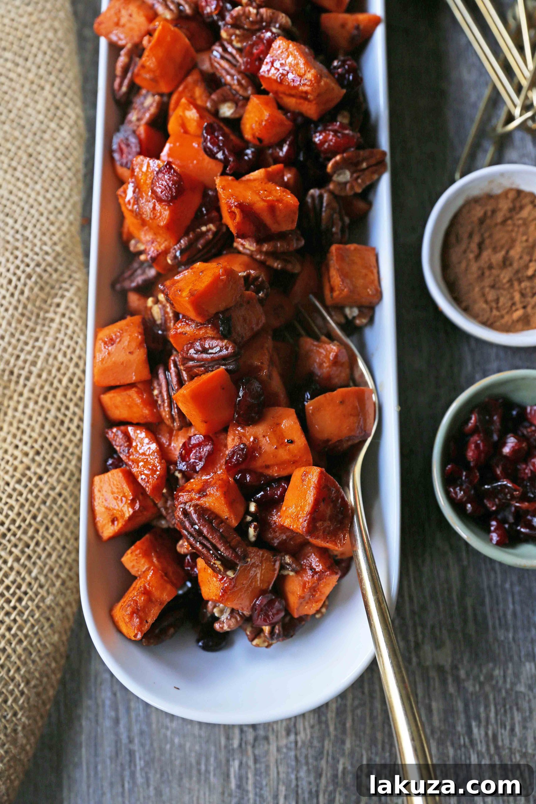 Roasted Sweet Potatoes with Pecans and Cranberries: Healthy, dairy-free side dish with cinnamon roasted sweet potatoes, toasted pecans, and dried cranberries.