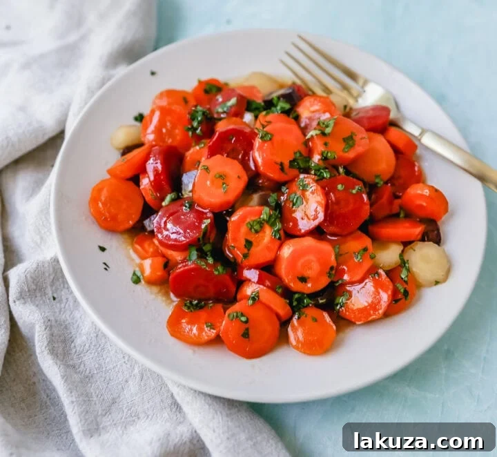 Honey Butter Glazed Carrots: Roasted carrots with butter, honey, salt, and lemon zest, a perfect classic side dish.