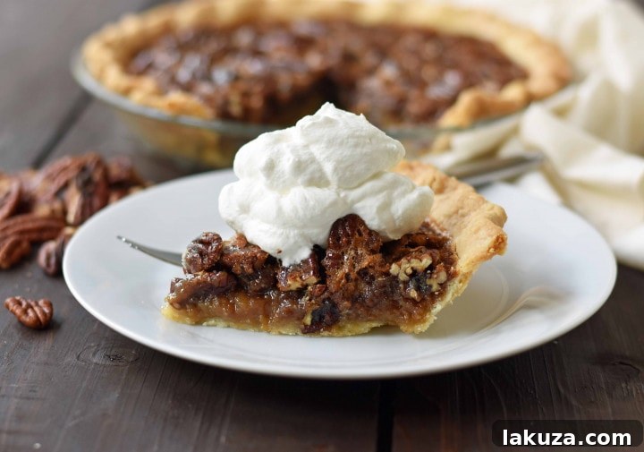 Old-Fashioned Pecan Pie: Silky smooth brown sugar butter filling with crunchy pecans, homemade whipped cream, and flaky crust.