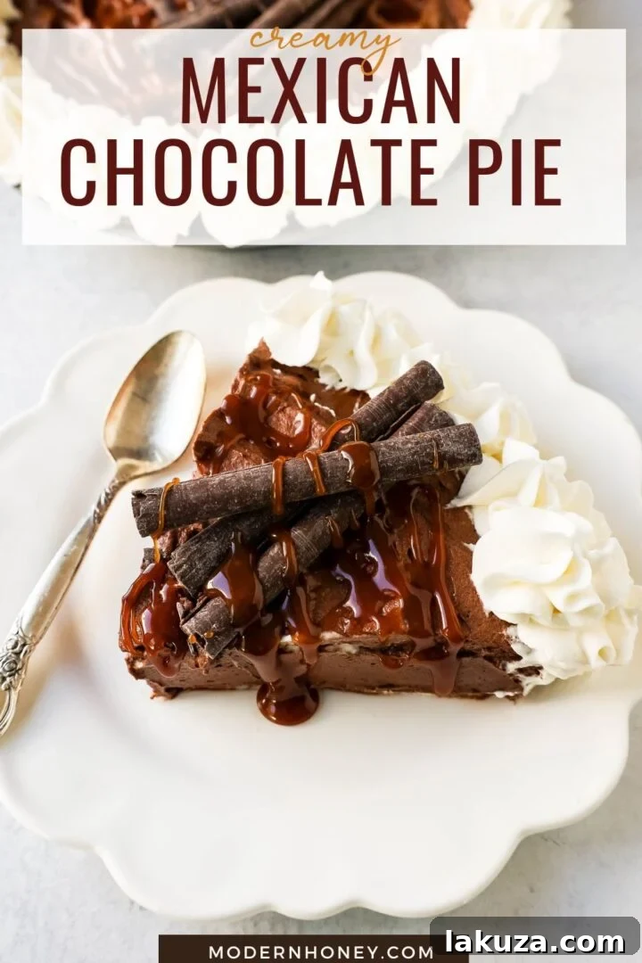 Beautifully decorated Mexican Chocolate Cream Pie, topped with elegant swirls of whipped cream and caramel drizzle, ready for serving.