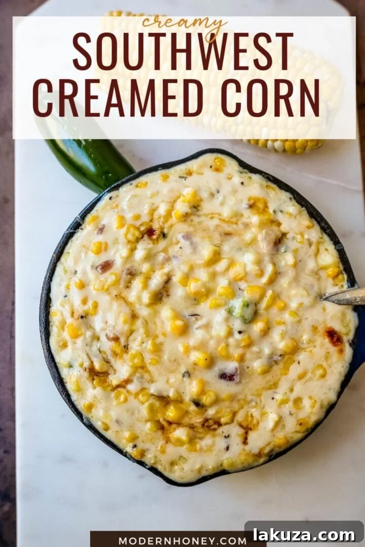 A vibrant bowl of Southwest Creamed Corn garnished with fresh parsley and a drizzle of hot honey.